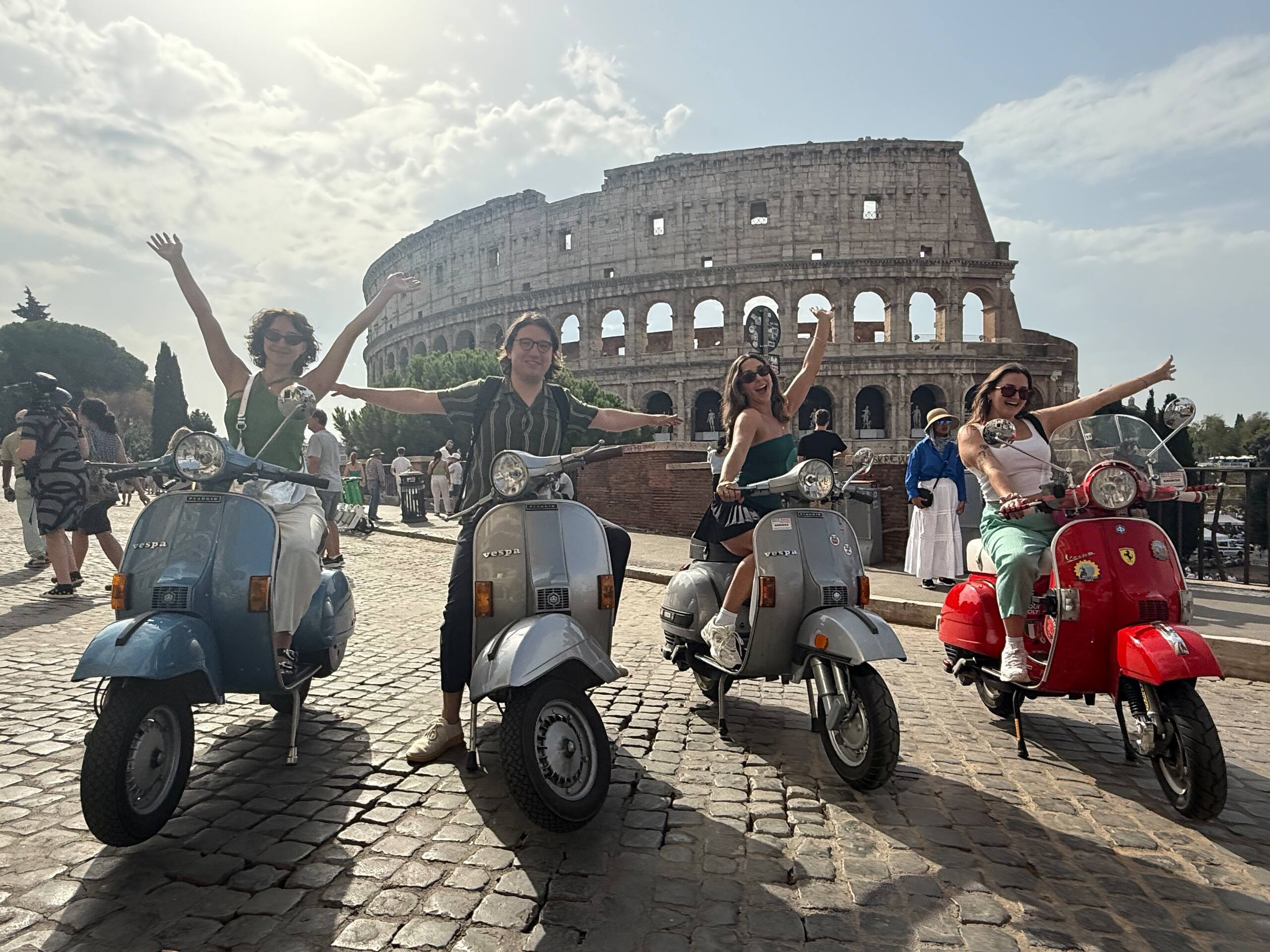 Vintage Vespa tour passing through Rome