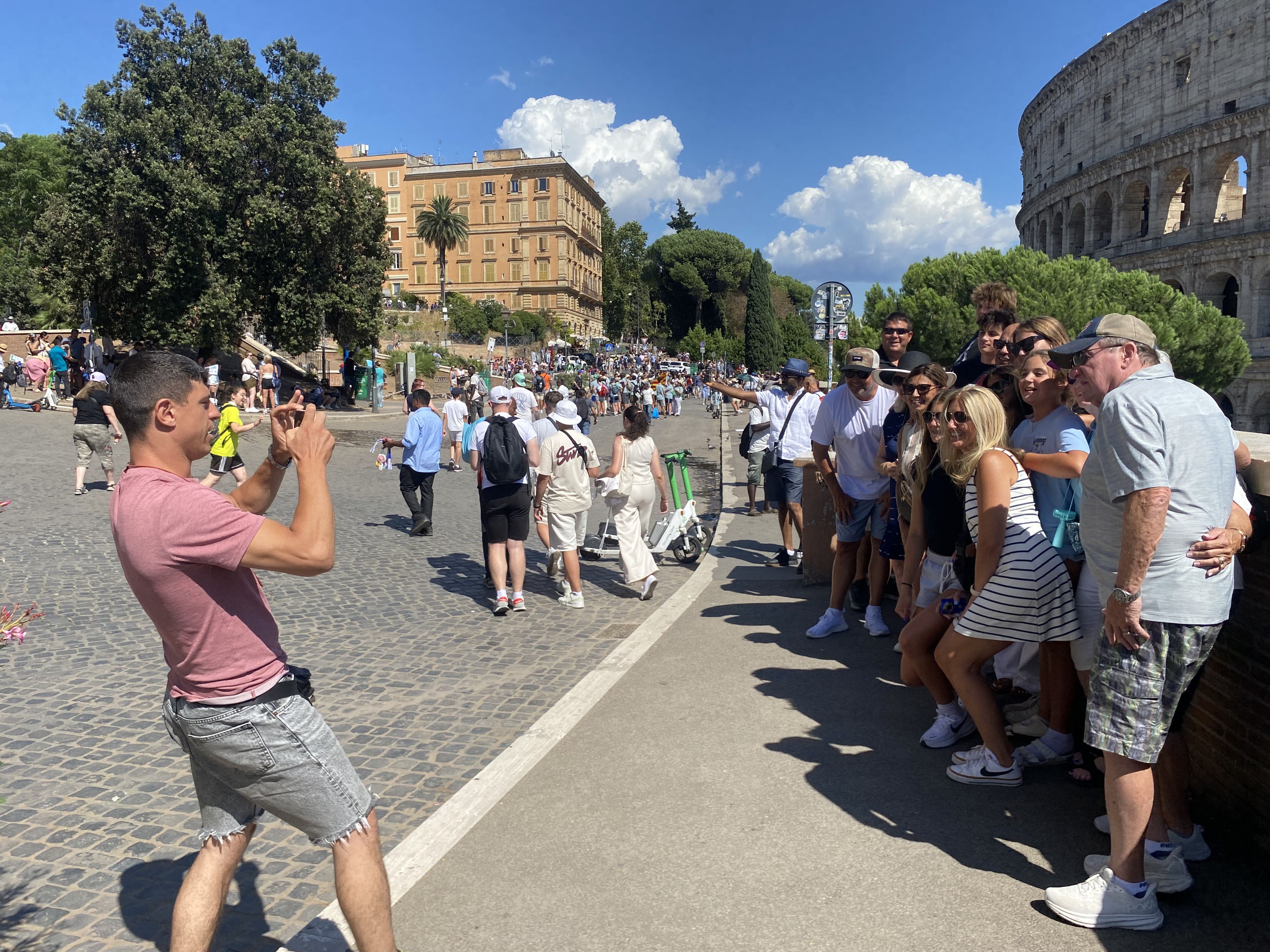 Travelers stopping for photos on a Vespa tour